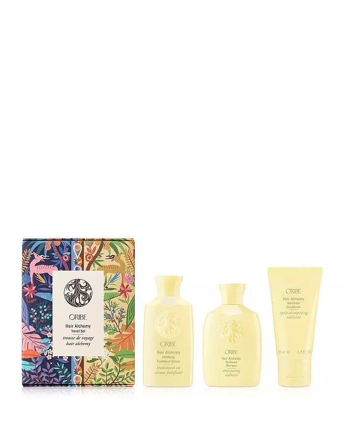 Oribe Hair Alchemy Collection Travel Gift Set ($50)
If your giftee often travels and laments the extra-hard or too-soft water when they're away, treat them to this set of hyaluronic acid-packed shampoo, conditioner, and serum. It'll strengthen their hair, while delivering moisture and shine, all in TSA-friendly packaging.