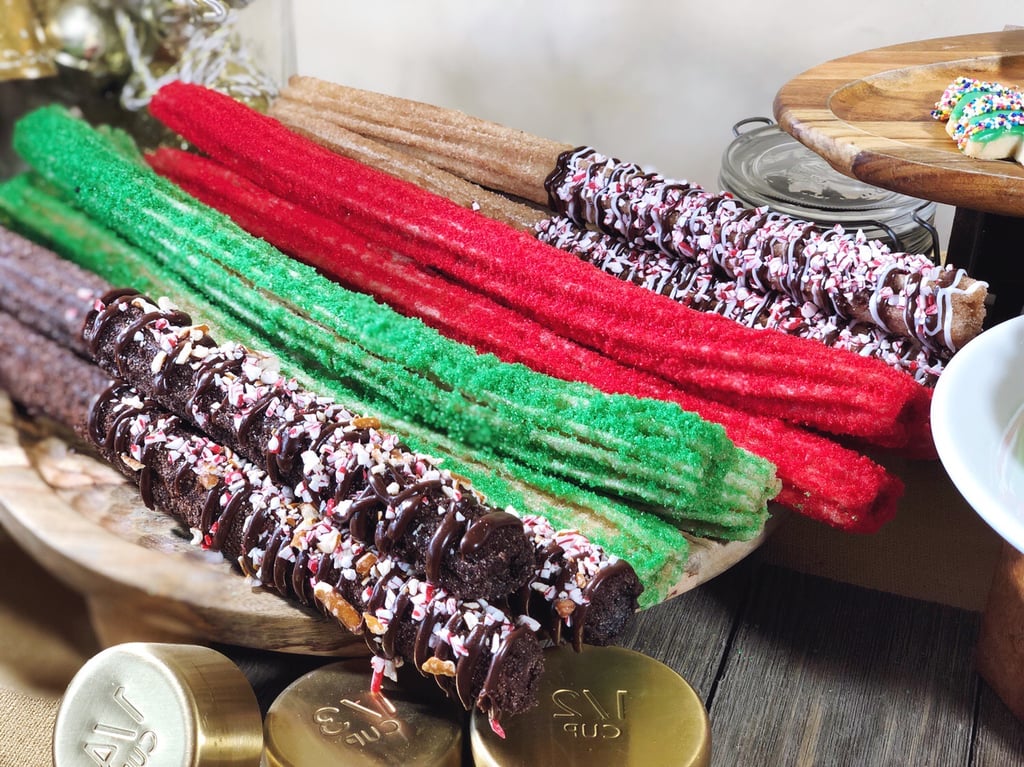 Here are the new chocolate churros pictured with the red and green churros (which can be found near Goofy's Sky School in California Adventure) and the peppermint churros with crushed candy canes and chocolate and vanilla icing (which can be found near the Redwood Creek Challenge Trail).