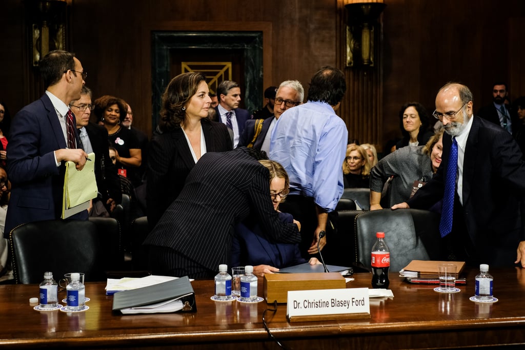 Ford is hugged by her attorney Katz following her testimony.