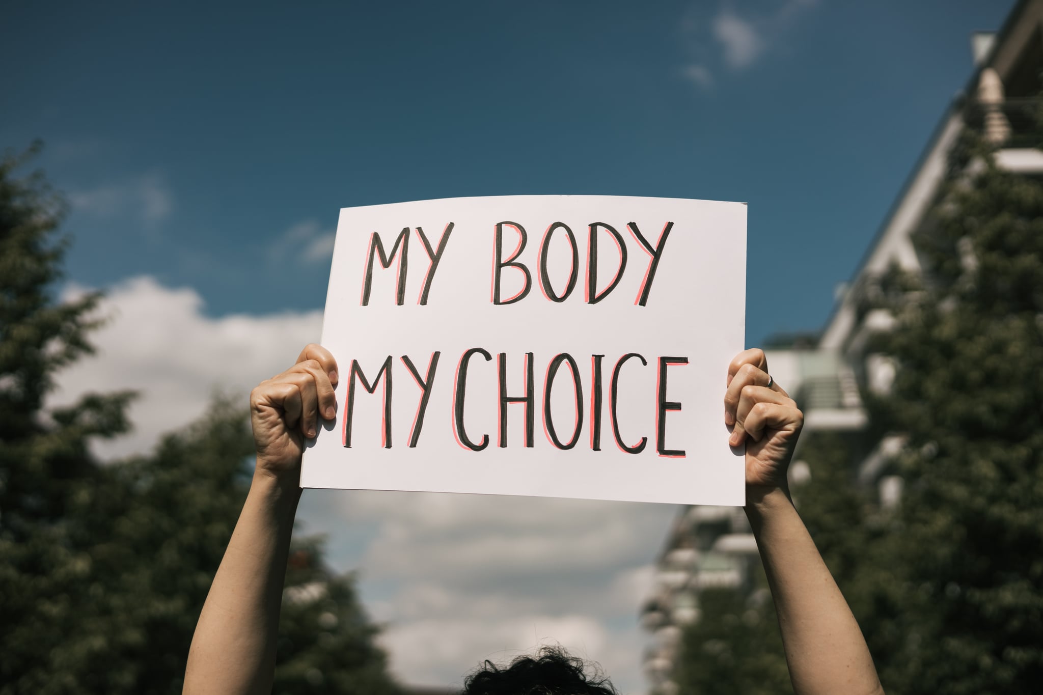 Woman holding a sign 