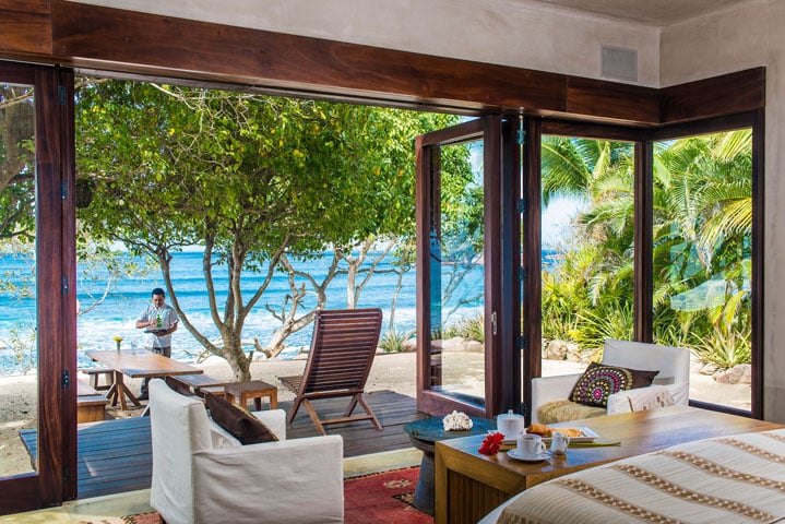 The "Aramara" master suite is only steps from the sand, and its bathroom includes both indoor and outdoor showers.