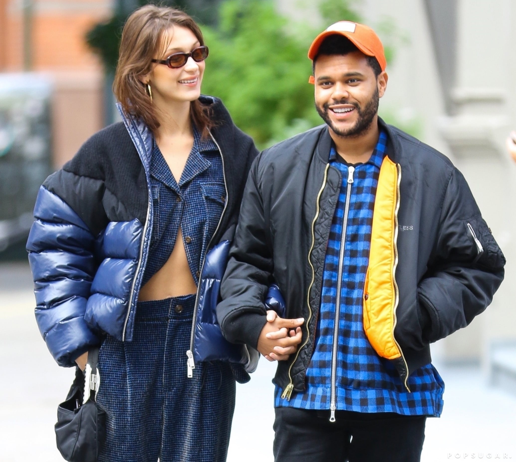 Bella Hadid wore a $1,690 puffer coat over what looked like denim pajamas  during a daytime stroll with The Weeknd