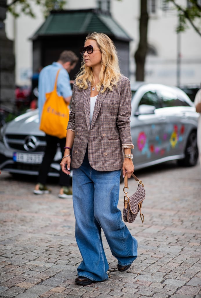 A chic plaid blazer lends baggy jeans some polish.