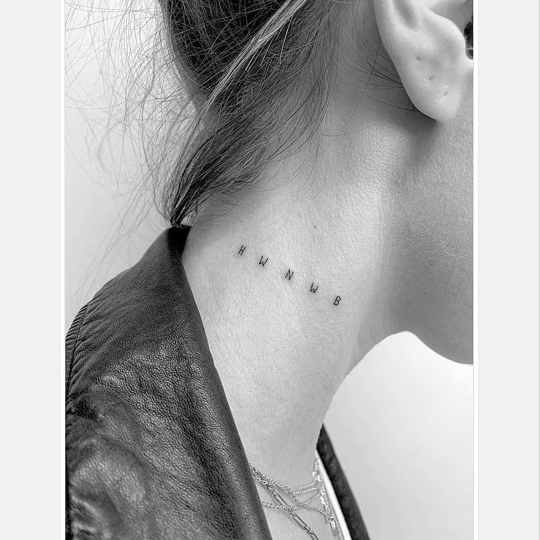 Fine line rose tattoo located on Tasha Ghouris neck