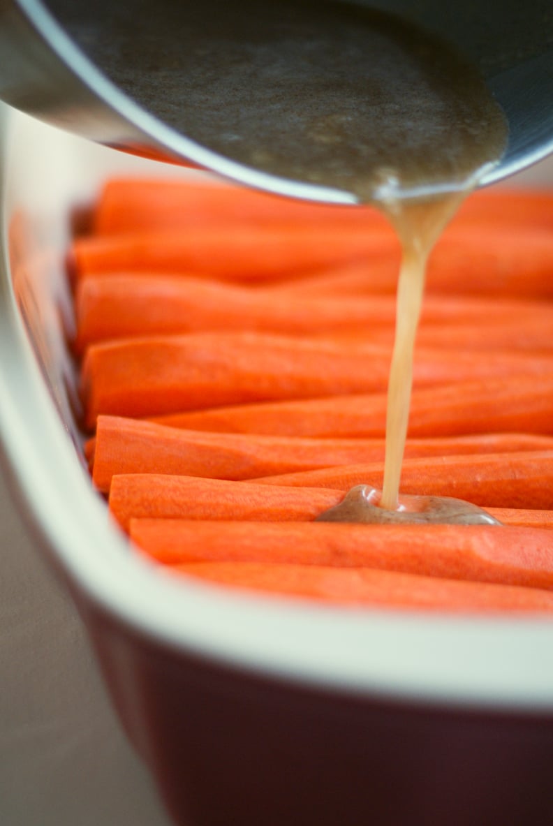 Cinnamon Butter Baked Carrots recipe: covering carrots in cinnamon butter sauce
