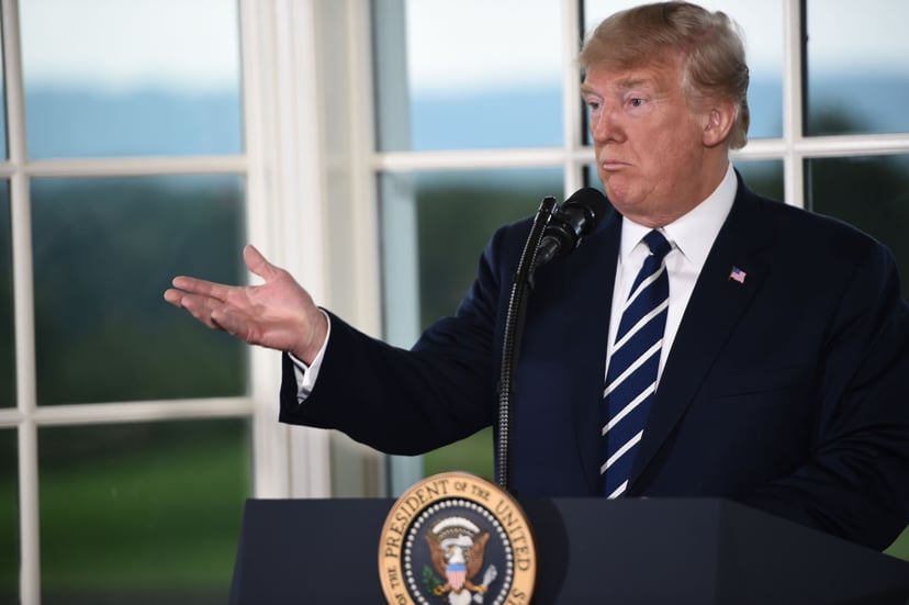 US President Donald Trump gestures as he speaks during a dinner with business leaders in Bedminster, New Jersey, on August 7, 2018. (Photo by Brendan SMIALOWSKI / AFP)        (Photo credit should read BRENDAN SMIALOWSKI/AFP/Getty Images)