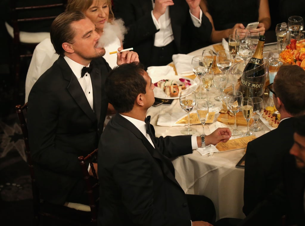 Leo lit up an electronic cigarette at his table, where he sat with the rest of his The Wolf of Wall Street cast. 
Source: Christopher Polk/NBC/NBCU Photo Bank/NBC