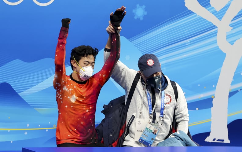 Nathan Chen of USA and his coach Rafael Arutyunyan celebrate the Gold medal at 'kiss and cry' following the Men Single Skating Free Skating on day six of the Beijing 2022 Winter Olympic Games.