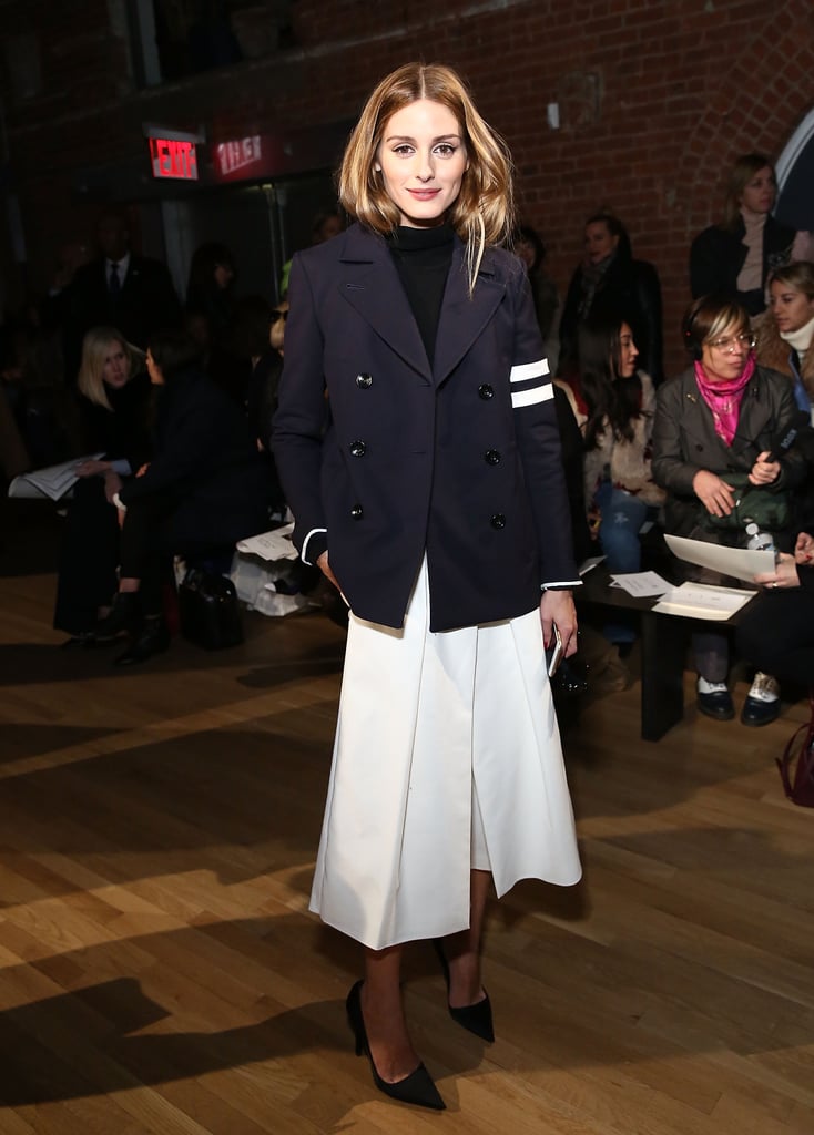 This preppy-meets-polished outfit is quintessential Olivia. The fashion insider arrived at Tibi in white culottes and a double-breasted jacket from the brand that only Olivia could pair perfectly.