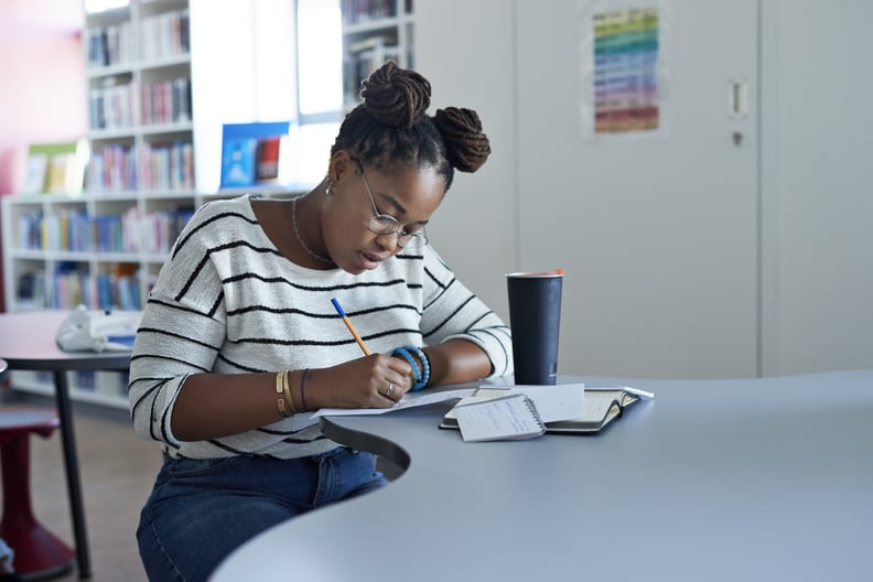 Woman writing to-do list. 