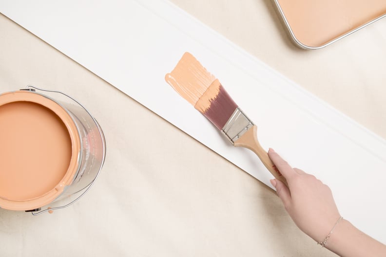 Try a pop of light orange on your baseboards