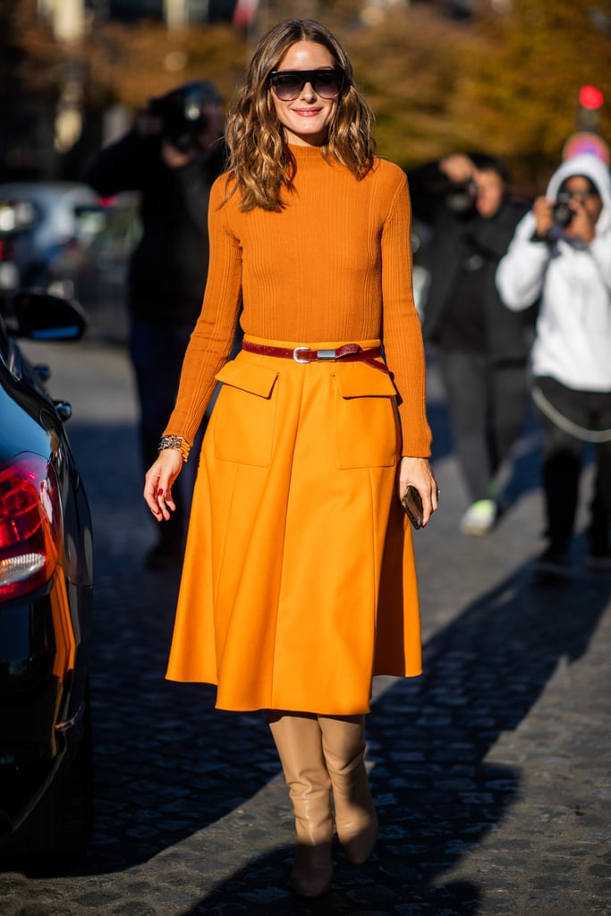 Committing to a color story, Olivia leaned into an orange palette for a polished take on monochromatic dressing.