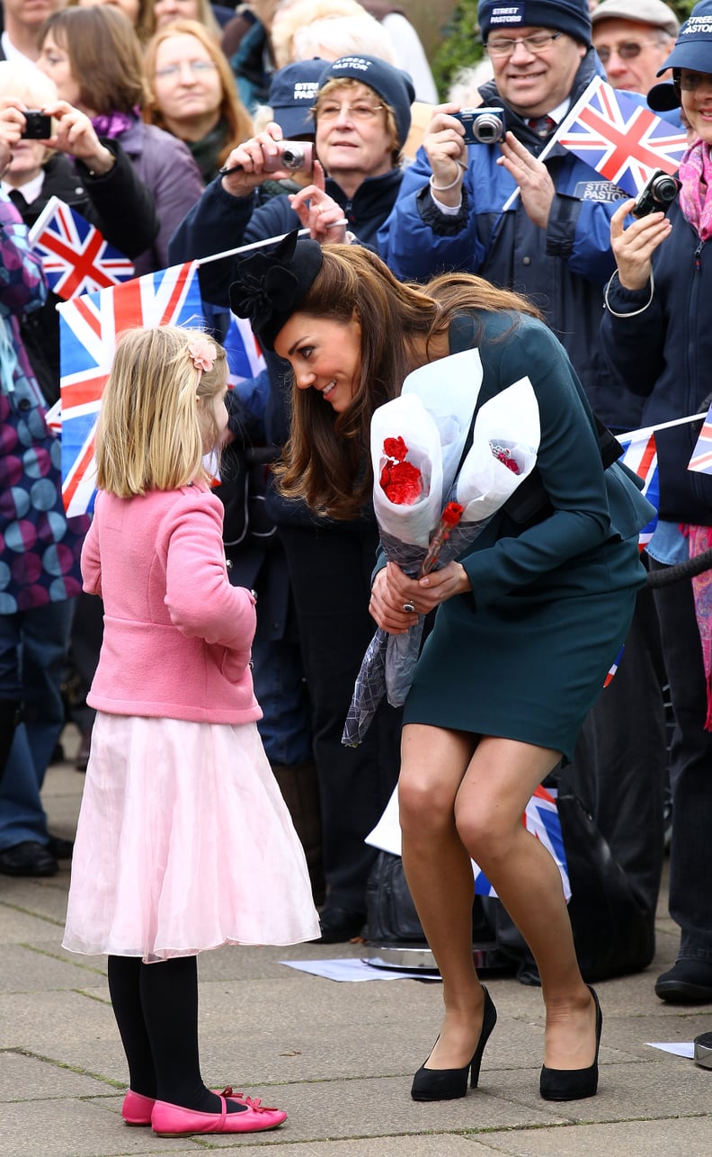 Kate Receiving Flowers From Children 2012