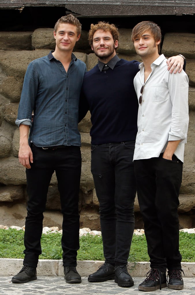 Sam Claflin had his arms around Douglas Booth and Max Irons at the Rome photocall for Posh in September 2014.