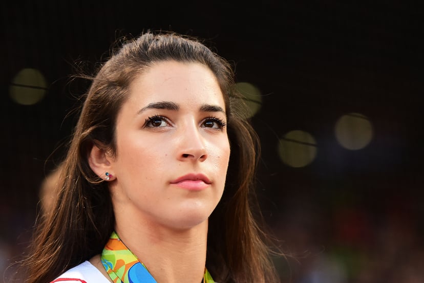 BOSTON, MA - AUGUST 26:  Olympic gymnast Aly Raisman looks on before throwing out a ceremonial first pitch before a game against the Kansas City Royals on August 26, 2016 at Fenway Park in Boston, Massachusetts.  (Photo by Adam Glanzman/Getty Images)