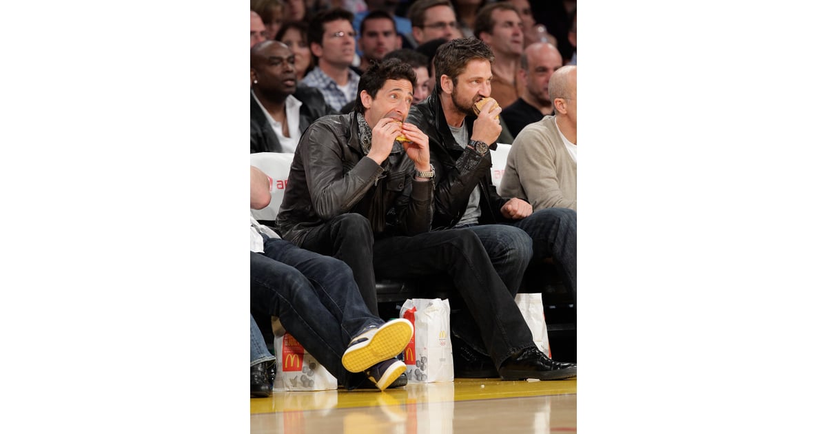 Adrien Brody and Gerard Butler chowed down on burgers while watching
