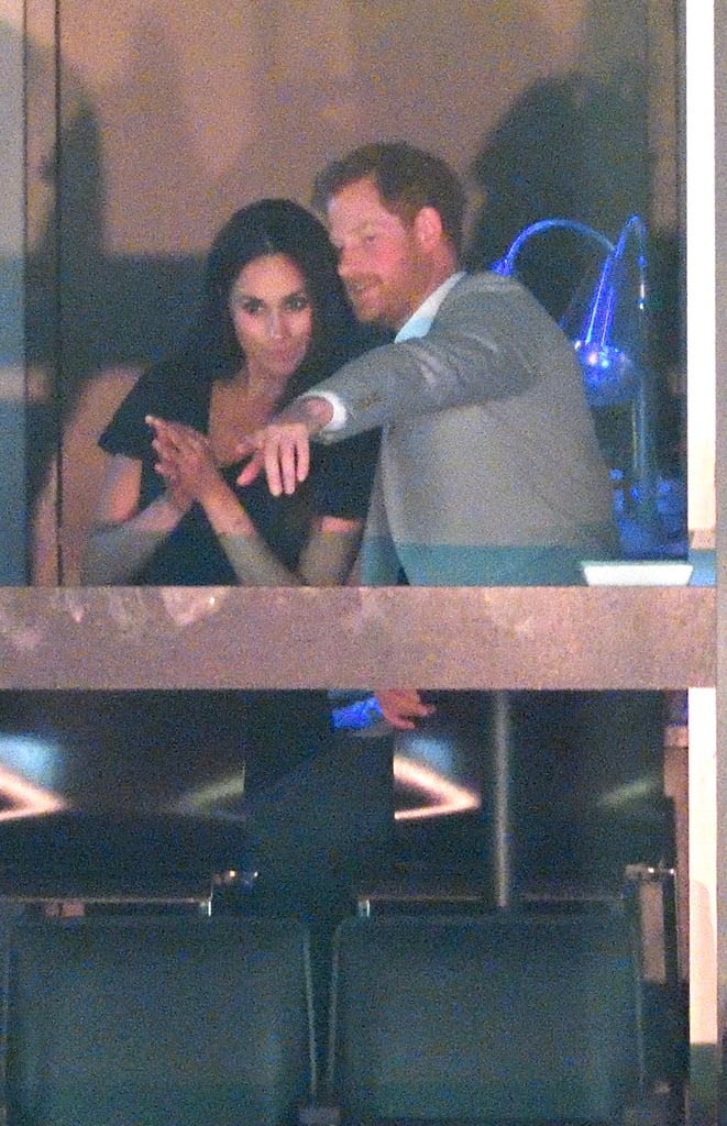Prince Harry Whispering in Meghan Markle's Ear Pictures