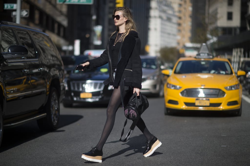 Behati Prinsloo showed off her love for her platform Stella McCartney creepers, pairing them with denim cutoffs and a black jacket.