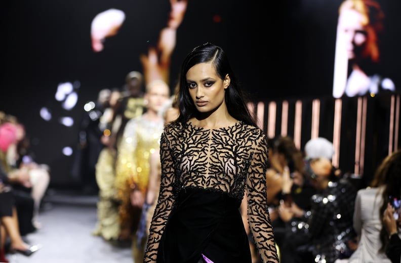 A model walks on the runway at the IA London fashion show during