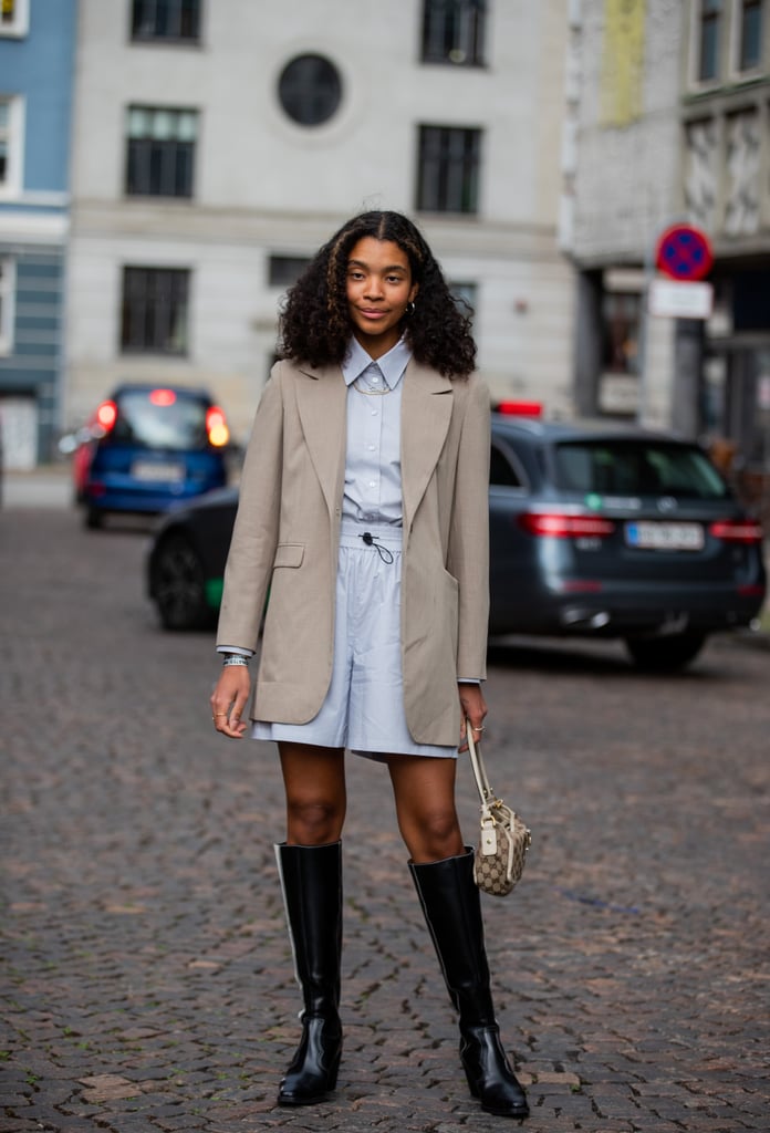 Outfit idea: Try wearing a tailored shorts set underneath an oversize blazer styled with knee-high boots.