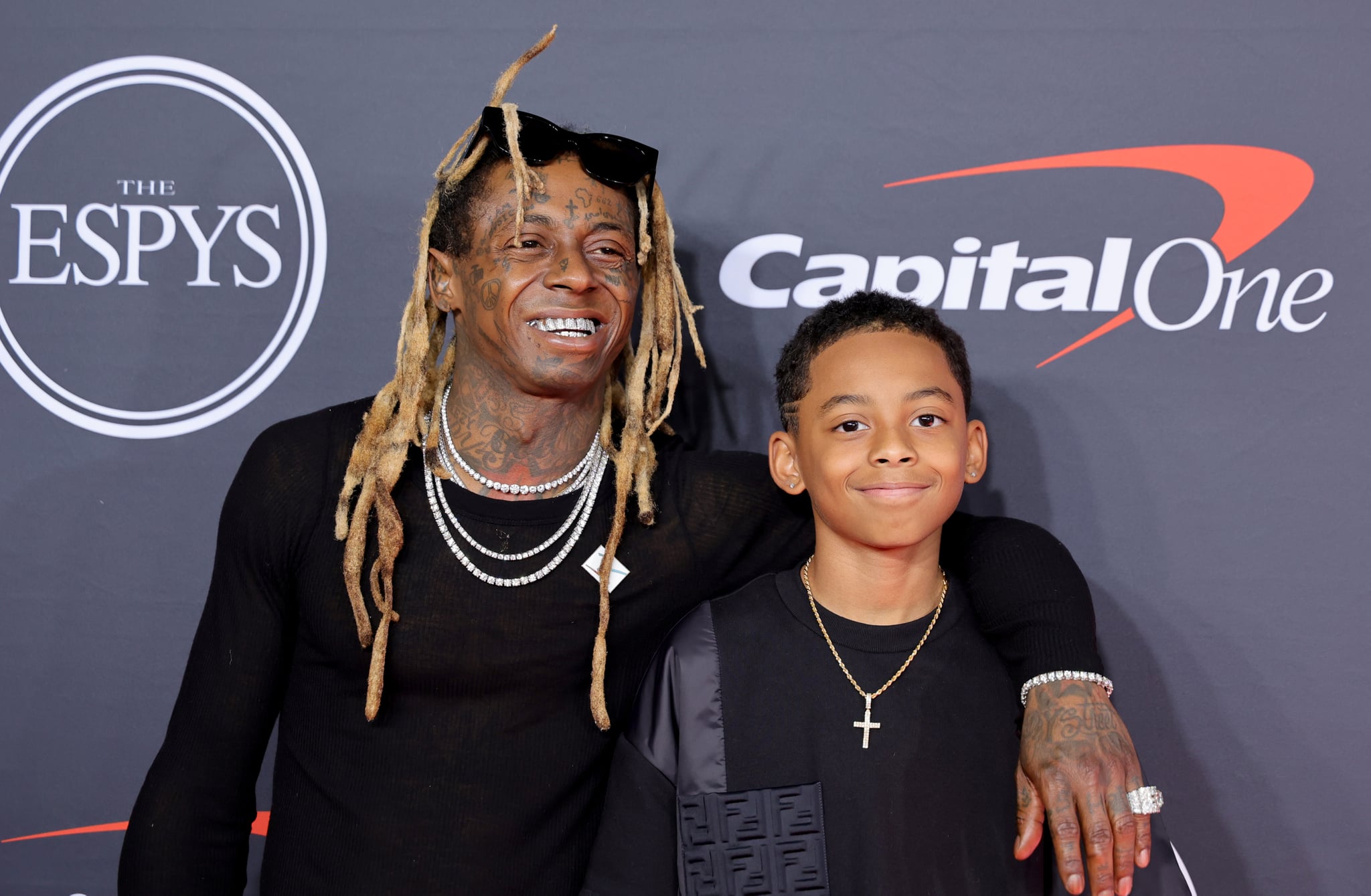 HOLLYWOOD, CALIFORNIA - JULY 20: (L-R) Lil Wayne and Kameron Carter attend the 2022 ESPYs at Dolby Theatre on July 20, 2022 in Hollywood, California. (Photo by Momodu Mansaray/WireImage)