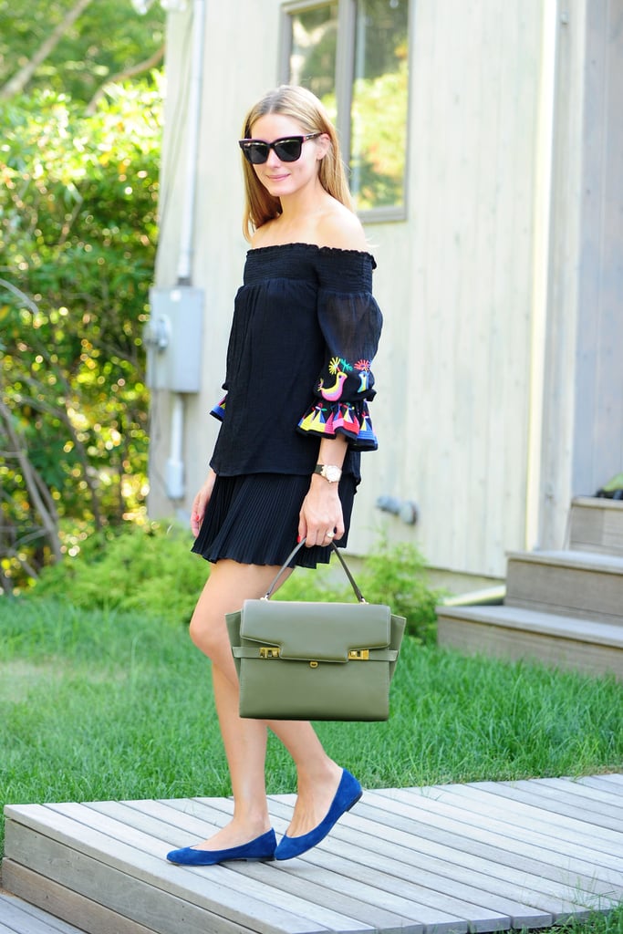 The dark palette with just a pop of color gives the look more of a transitional feel.