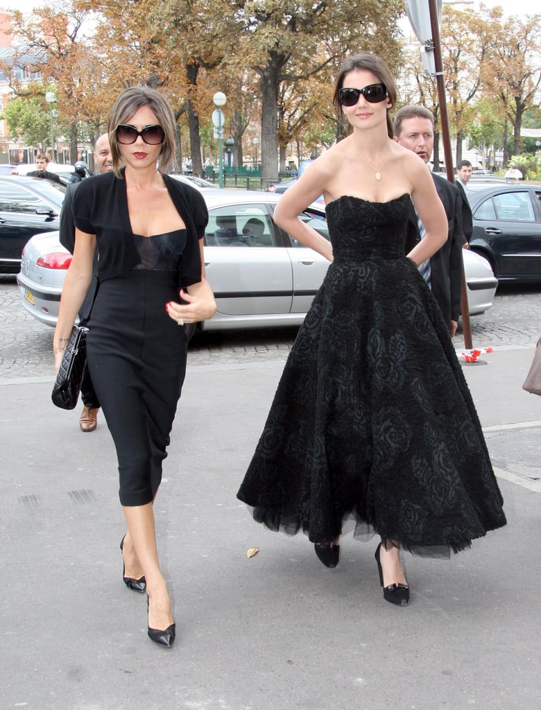 Victoria in Paris with Katie Holmes in 2006, wearing a bustier-style dress.