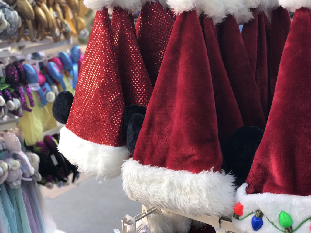Guests Can Don Their Own Santa Claus Hats, Some Decked With Mickey Ears and Christmas Lights.