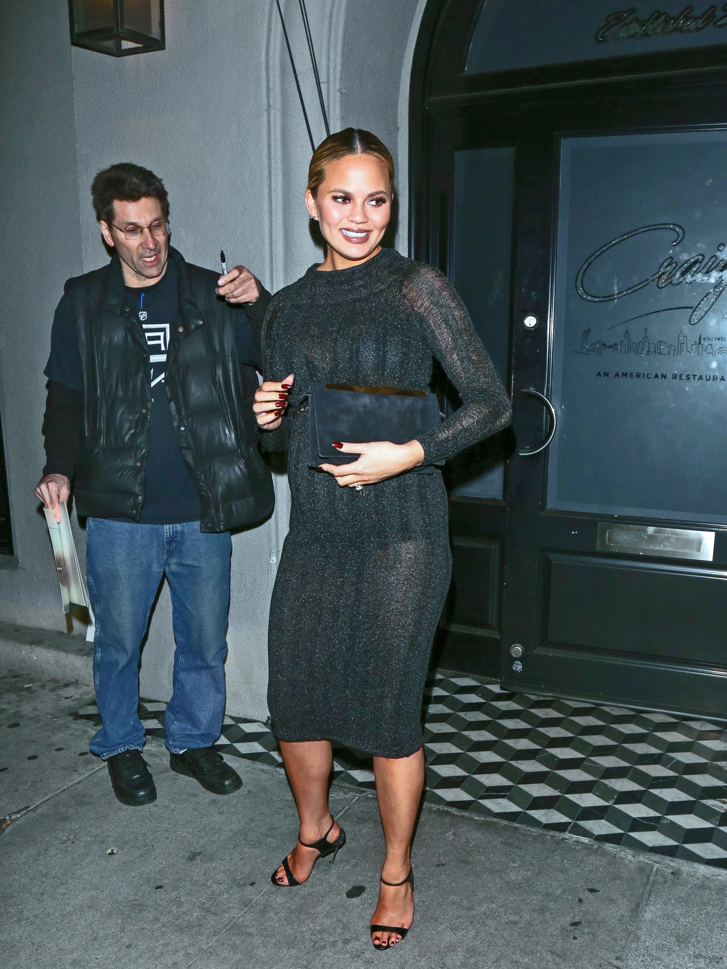 Chrissy Teigen Wore a Sheer Lacy Top for a Date Night at a Drake