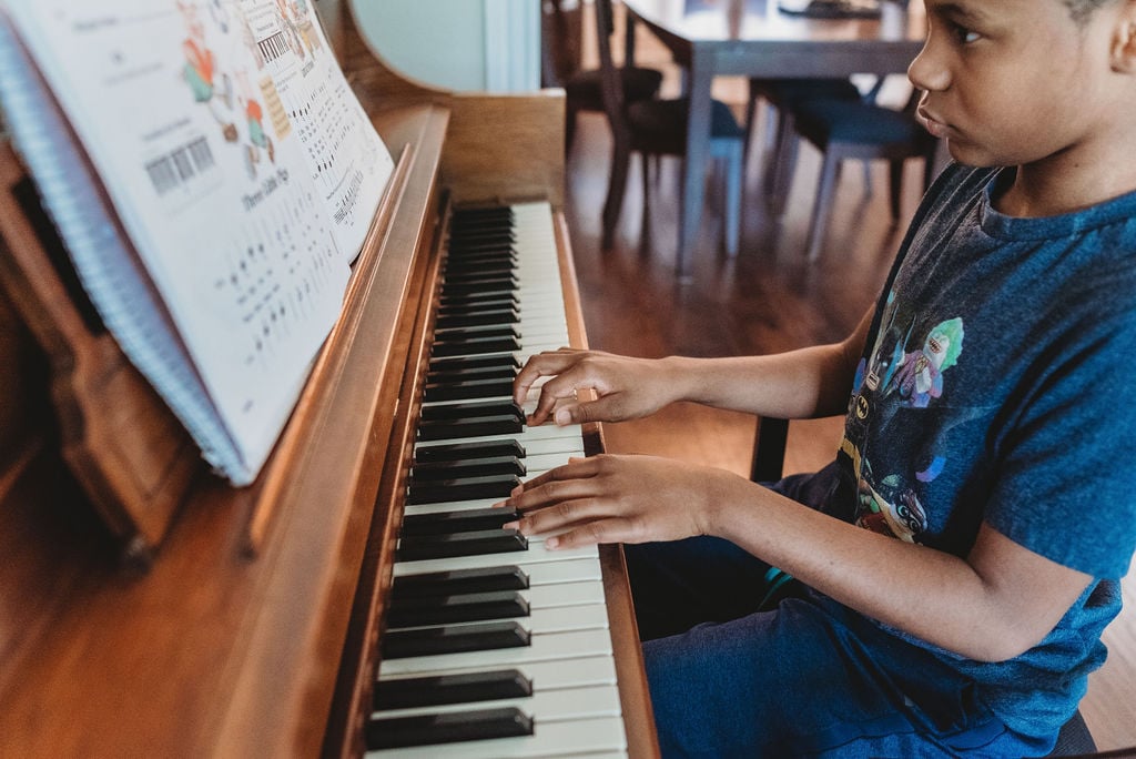 "Ashton has been learning the piano for several years. He enjoys it and can play a little by ear. He states that some of his other interests include pizza and video games. He also noted that he hates running."