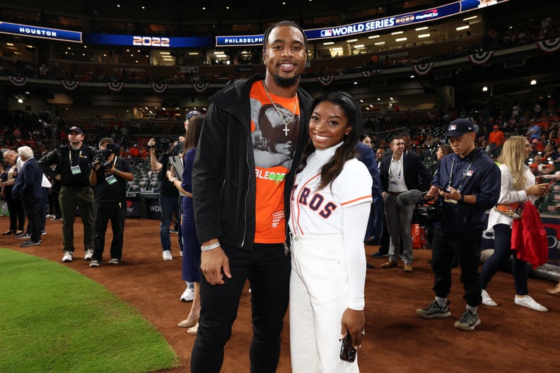 HOUSTON, TX - OCTOBER 28:  Olympic gold medalist Simone Biles and Houston Texans safety Jonathan Owens are seen prior to Game 1 of the 2022 World Series between the Philadelphia Phillies and the Houston Astros at Minute Maid Park on Friday, October 28, 20