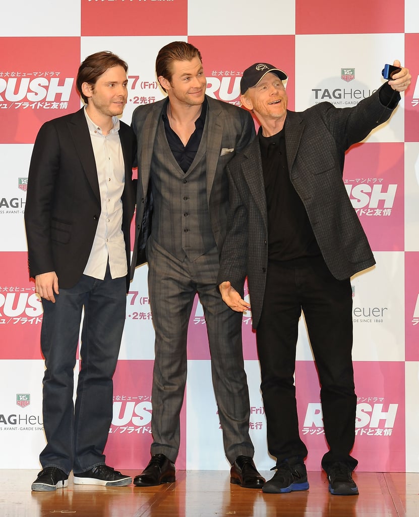 Ron Howard took a selfie with Chris Hemsworth and Daniel Brühl at a Rush press conference on Tuesday.