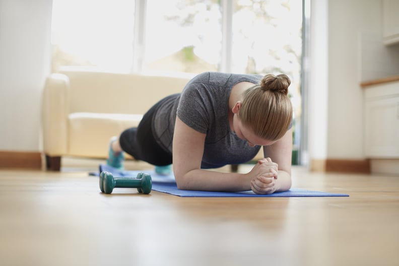 Young woman in plank position.