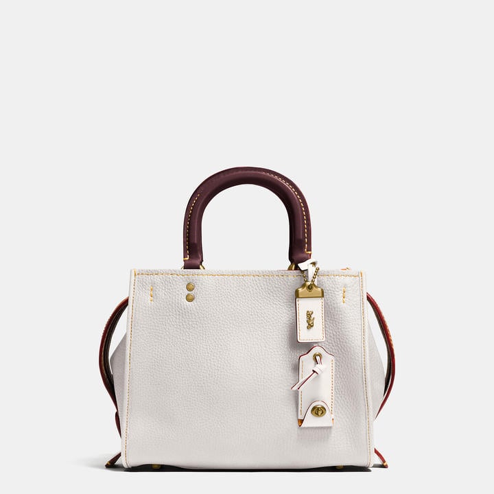 This simple Coach Rogue 25 in glovetanned pebble leather ($595) satchel was made for paring it down with style.