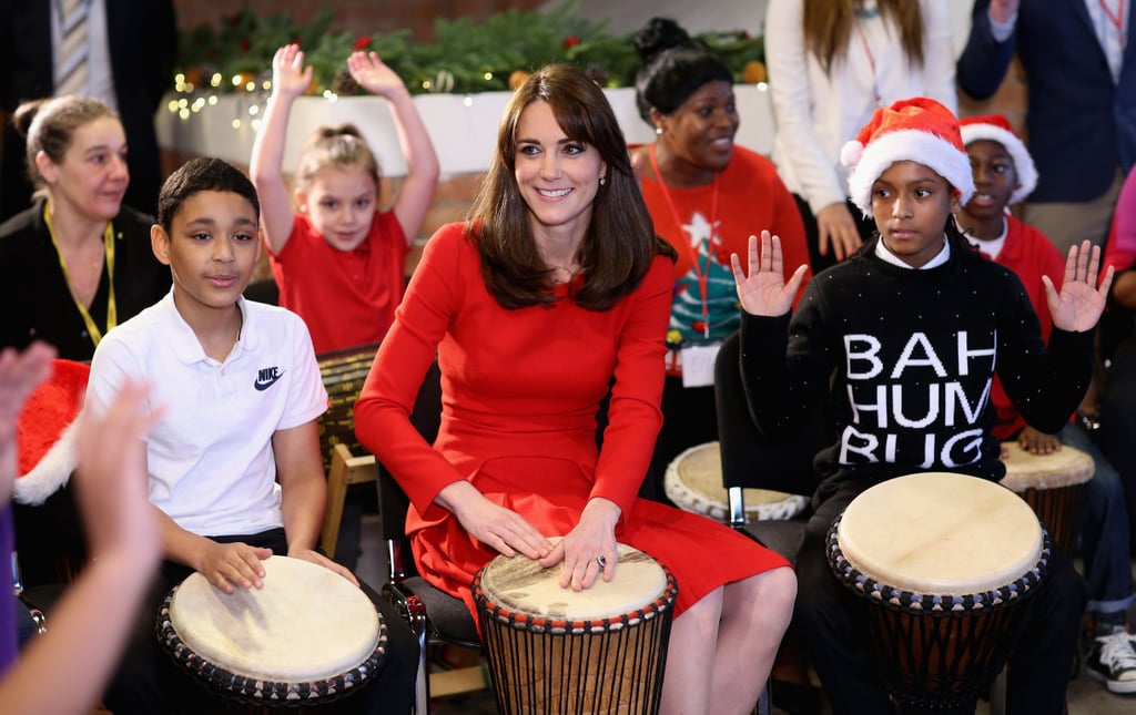 She showed off her sapphire engagement ring as she played the drums.