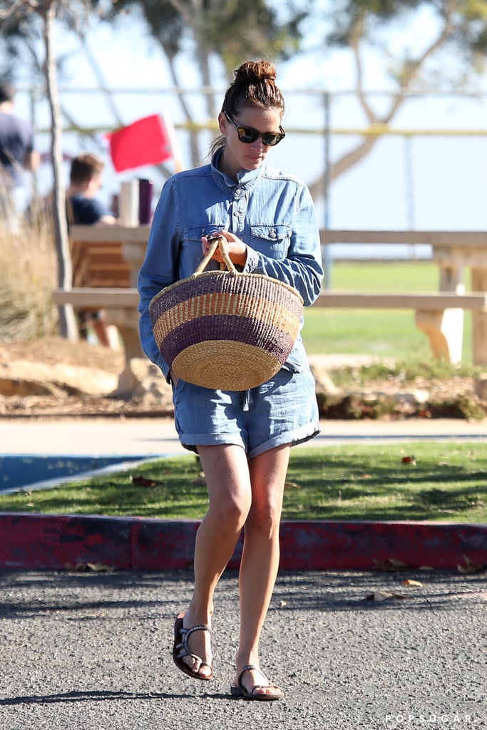 Julia styled her long-sleeved chambray romper with her basket tote and eye-catching sandals in Malibu in October 2016.
