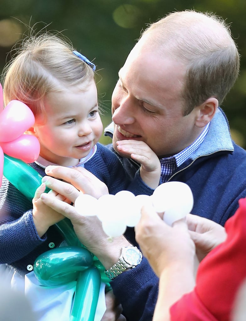 William made Charlotte crack a smile at a children's party for military families.