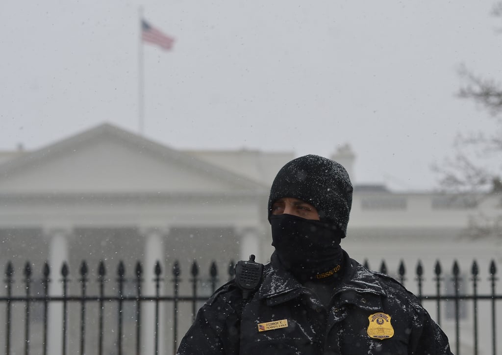 A White House worker covered up for the chilly temperatures in Washington DC.