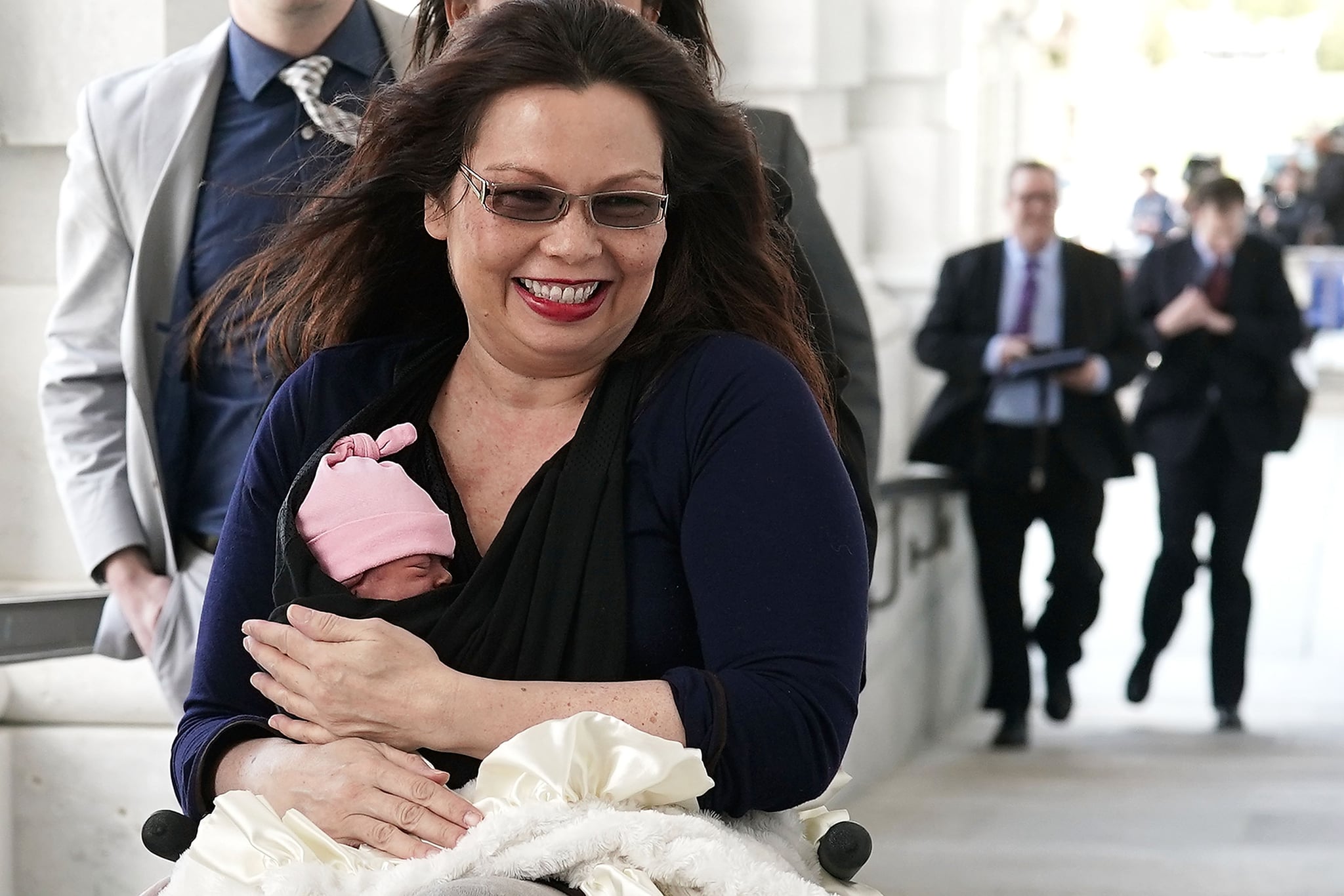 WASHINGTON, DC - APRIL 19:  U.S. Sen. Tammy Duckworth (D-IL) arrives at the U.S. Capitol with her newborn baby daughter Maile Pearl Bowlsbey for a vote on the Senate floor April 19, 2018 on Capitol Hill in Washington, DC. The Senate has voted through by unanimous consent last night to change rules to allow newborn babies under one year old on the floor during votes.  (Photo by Alex Wong/Getty Images)