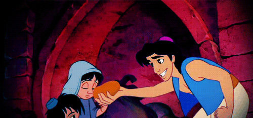 When Aladdin shares his loaf of bread with two children.
