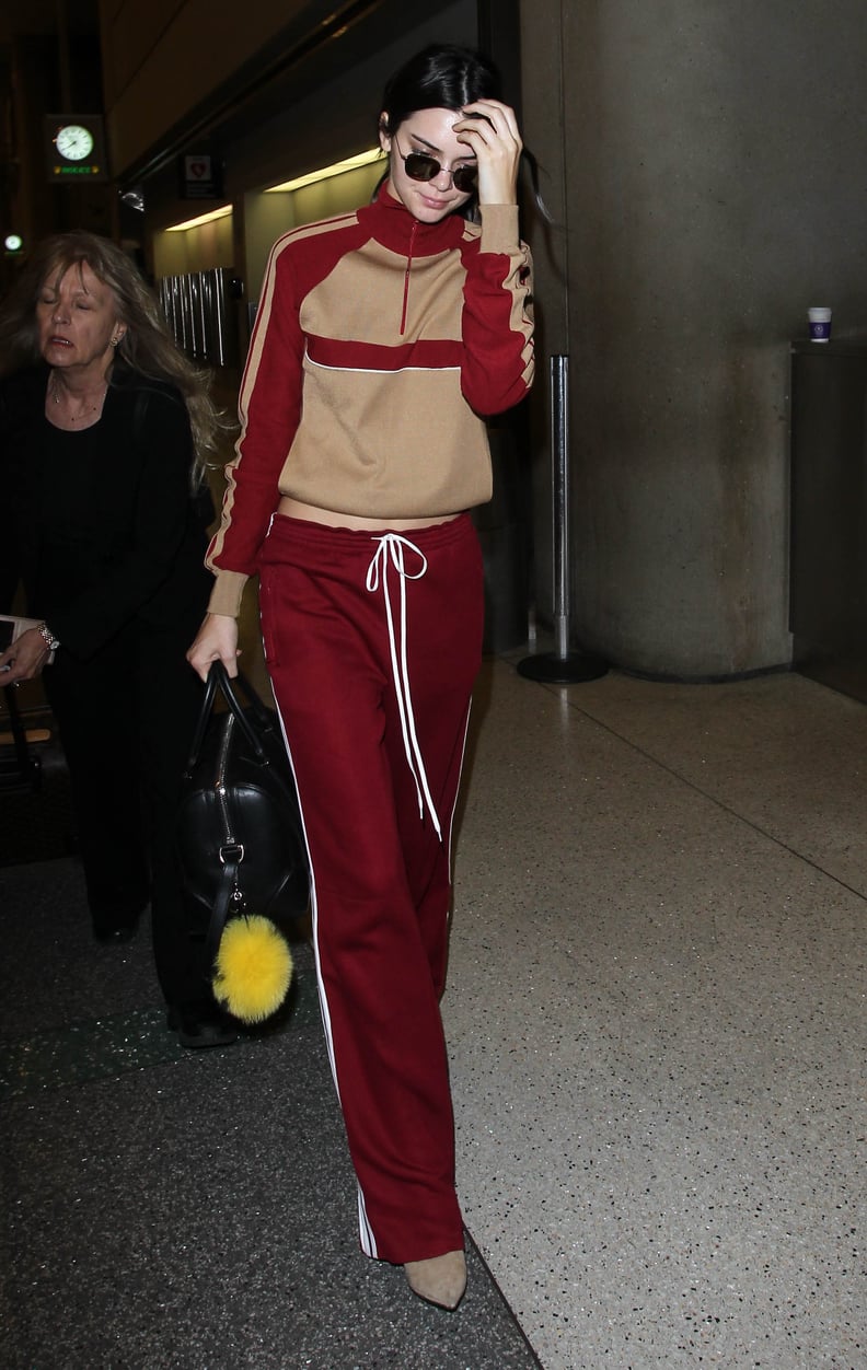 Kendall Jenner Opted to Match Her Trackpants With a Red and Beige Pullover Rather Than a Zip-Up