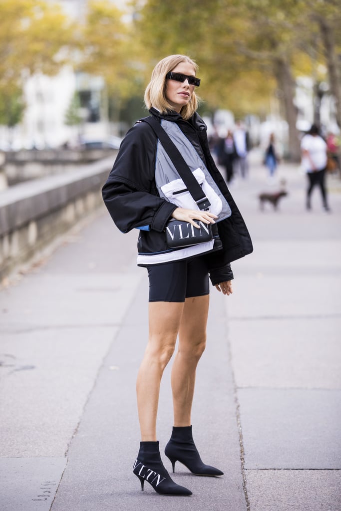 Biker shorts and a windbreaker look decidedly cooler with a fresh pair of ankle boots.
