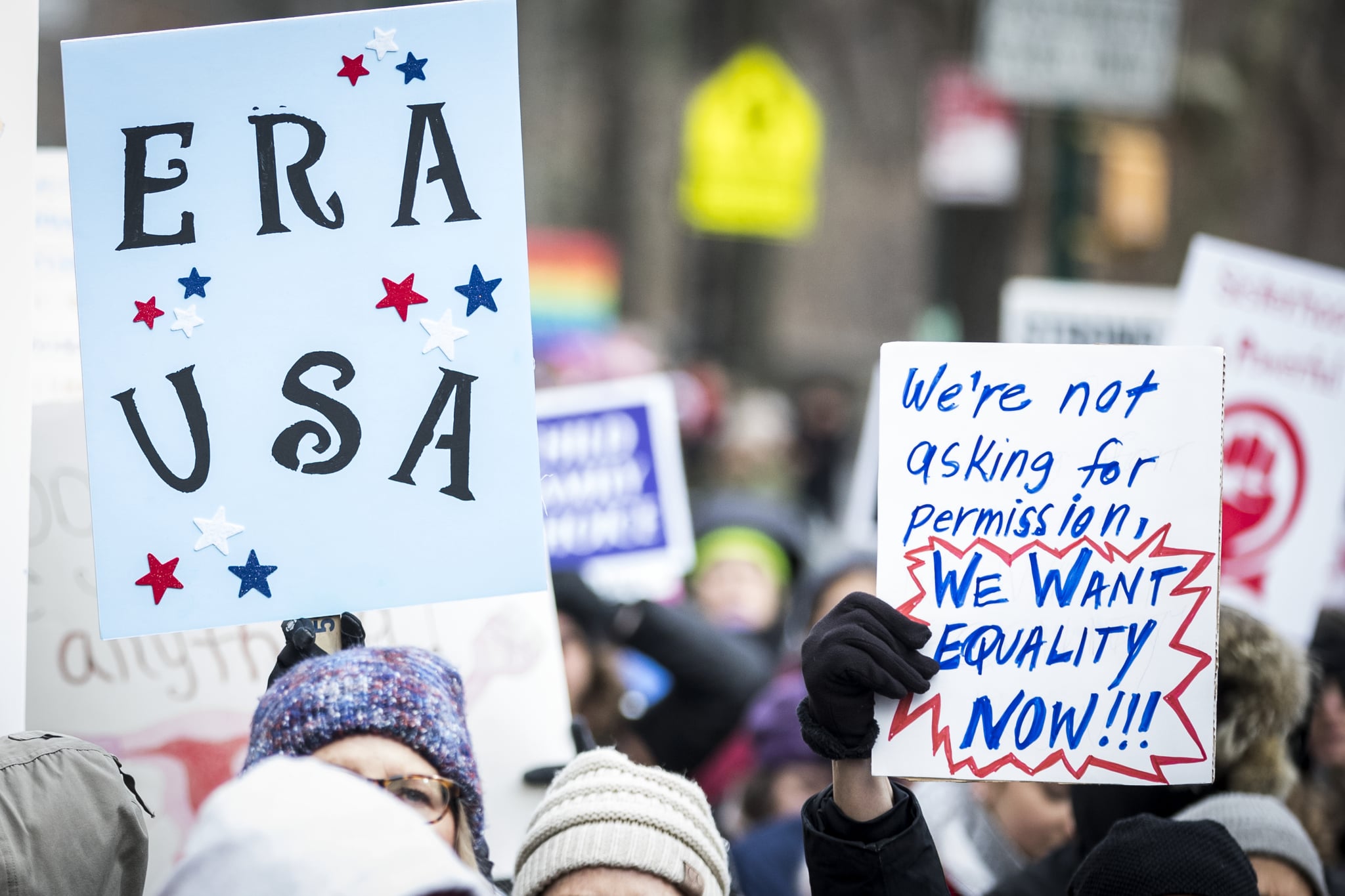 MANHATTAN, NY - JANUARY 18: Marchers hold signs that say,