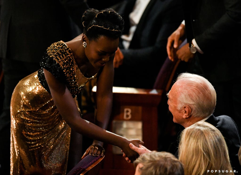 Lupita Nyong'o shook hands with Christopher Plummer.