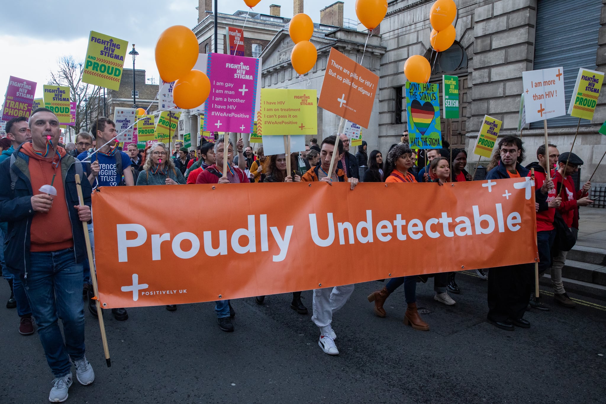 Representatives of Positively UK join over 20 HIV organisations marching along Whitehall to stand up against HIV stigma on 18 March 2023 in London, United Kingdom. HIV and HIV-related stigma disproportionately impact LGBT+ communities. According to the most recent estimate, there were 106,890 people living with HIV in the UK in 2019, of which around 5,150 undiagnosed. (photo by Mark Kerrison/In Pictures via Getty Images)