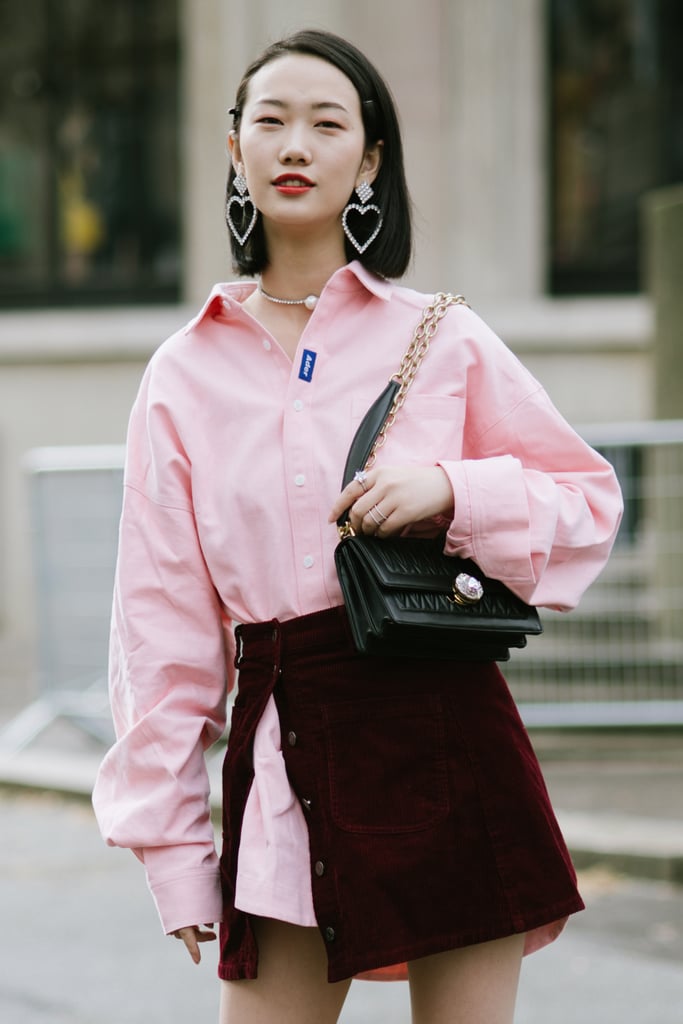 Layer up with a pink shirtdress and side-slit burgundy skirt on top.