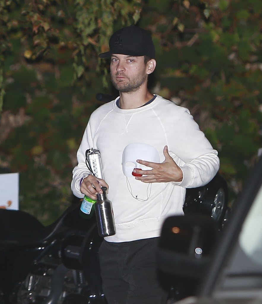 Tobey Maguire Carrying a Baby Mask