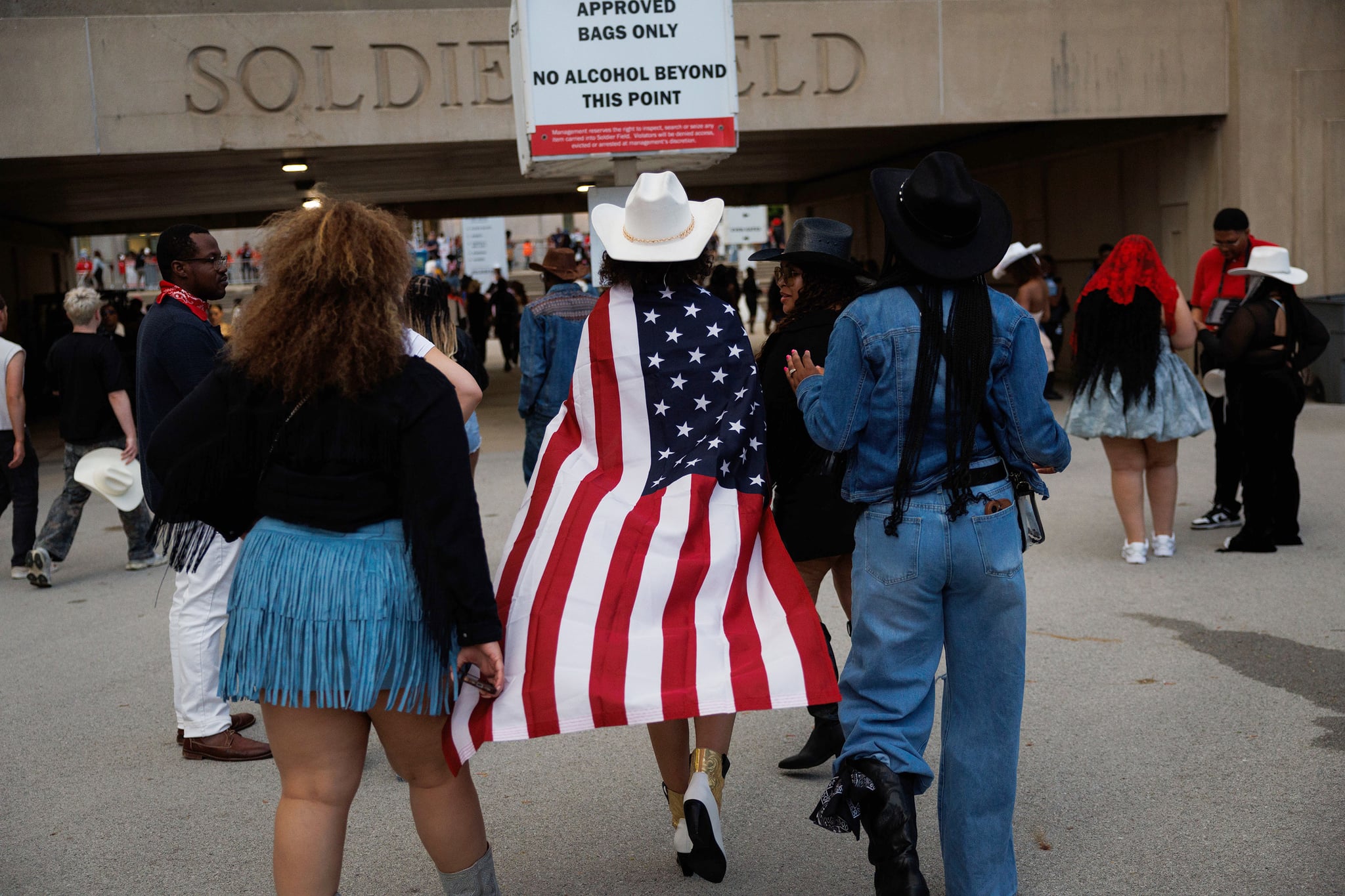 Elisabeth Johnson, 14, of Cincinnati, wears an American flag outside Soldier Field before attending the first night of Beyoncé's Cowboy Carter Tour performance Thursday May 15, 2025, in Chicago. (Armando L. Sanchez/Chicago Tribune/Tribune News Service via Getty Images)