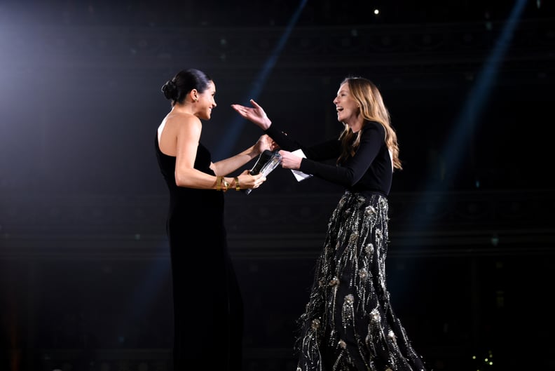 LONDON, ENGLAND - DECEMBER 10:  Meghan, Duchess of Sussex presents the award for British Designer of the Year Womenswear Award to Clare Waight Keller for Givenchy during The Fashion Awards 2018 In Partnership With Swarovski at Royal Albert Hall on Decembe