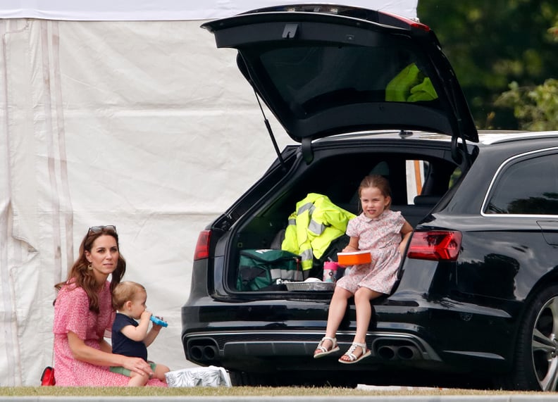 Charlotte looks happy as a clam holding her box of snacks, soon to be devoured.